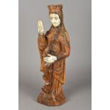 An antique Indo-Portuguese ivory mounted carved wooden model of the Virgin Mary Typically modelled