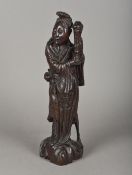 A Chinese carved hardwood wooden figure Modelled standing, in a silver wired decorated robe. 40.