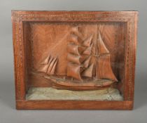 A 19th/20th century carved wood ship diorama Worked in full sail,