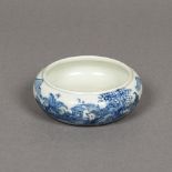 A Chinese blue and white porcelain bowl Decorated with a fisherman opposing a continuous landscape,