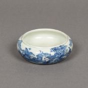 A Chinese blue and white porcelain bowl Decorated with a fisherman opposing a continuous landscape,