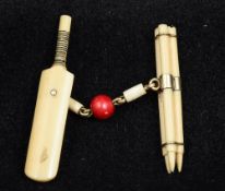 An unusual Victorian unmarked gold mounted ivory cloak clasp Formed as cricket stumps,