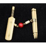 An unusual Victorian unmarked gold mounted ivory cloak clasp Formed as cricket stumps,