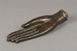 An antique Eastern patinated bronze model of the hand of Buddha 21 cm long.