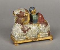 A Chinese cloisonne group Worked as a figure reclining on a recumbent ram,