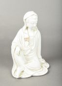 A Chinese blanc de chine porcelain figure of Guanyin Worked seated with one knee raised.