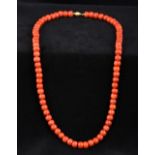A single strand coral bead necklace Se