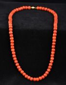 A single strand coral bead necklace Se