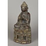An antique cast iron model of Buddha Ty