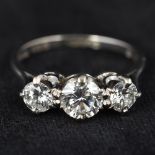 An 18 ct white gold three stone diamond