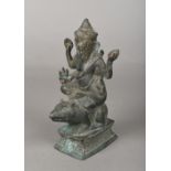 An antique Indian cast bronze figure of