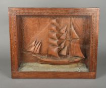 A 19th/20th century carved wood ship dio