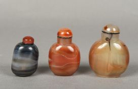 Three Chinese carved agate snuff bottles