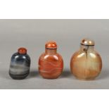 Three Chinese carved agate snuff bottles