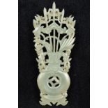 An unmarked silver and carved jade brooc