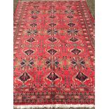 A Turkman wool carpet The wine red fiel