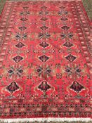 A Turkman wool carpet The wine red fiel