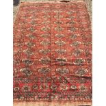 A Tekke wool rug The wine red field enc