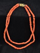 A two strand coral bead necklace