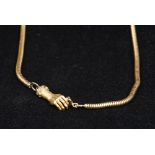 A 9 ct gold snake link chain set with a