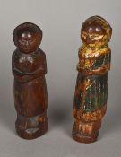 A pair of antique carved wood and polych