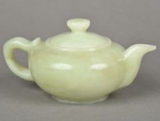 A jade teapot Of typical squat form. 1