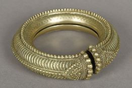 An African cast metal armlet Worked wit