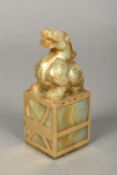 A Chinese carved russet jade and gilt de