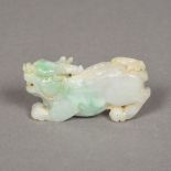 A Chinese carved pale green jade temple