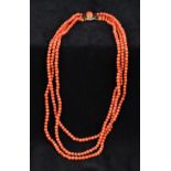 A three strand coral bead necklace Set