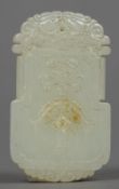 A Chinese carved celadon glaze pendant t