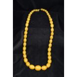 A butterscotch amber bead necklace The