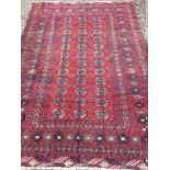 A Tekke wool carpet The wine red field