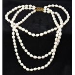 A three strand baroque pearl necklace M