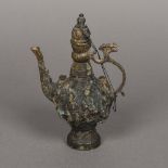 A Chinese cast metal ewer The body reli