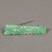 A Chinese carved green jade brooch Work