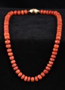 A single strand coral bead necklace