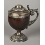 A George III silver mounted coconut tank