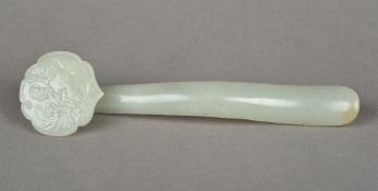 A Chinese carved celadon jade ruyi scept