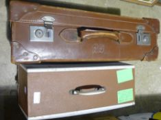 A sewing machine and a vintage suitcase