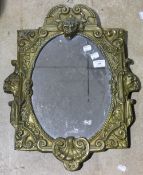 A 19th century pressed brass mirror