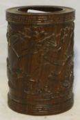 A Chinese wooden brush pot