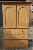 A Victorian pine linen press