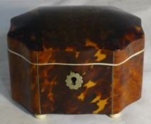 A small tortoiseshell tea caddy