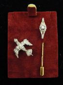 An Edwardian gold and diamond stick pin and a small diamond brooch in the form of a bird