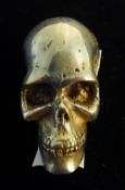 A silvered model of a skull