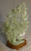 A jade carving of birds in a tree