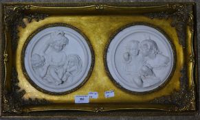 A decorative framed double plaque