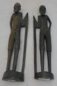 A pair of African carved wooden figures