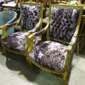 A pair of gilt wood framed upholstered open armchairs